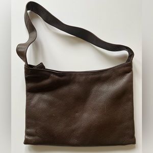 Gently used 100% leather The Sak dark brown purse.
